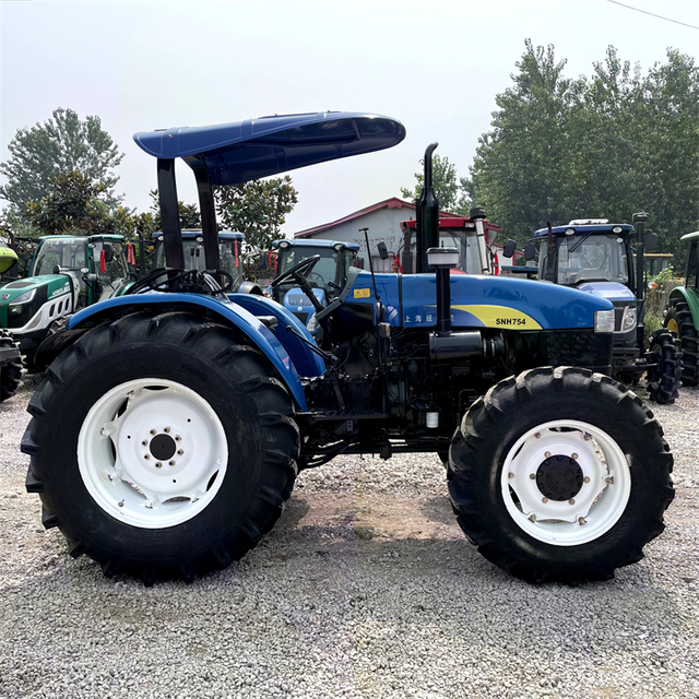 Использовал NEW HOLLAND SNH754 Tractor 4WD с навесным и сельскохозяйственным оборудованием